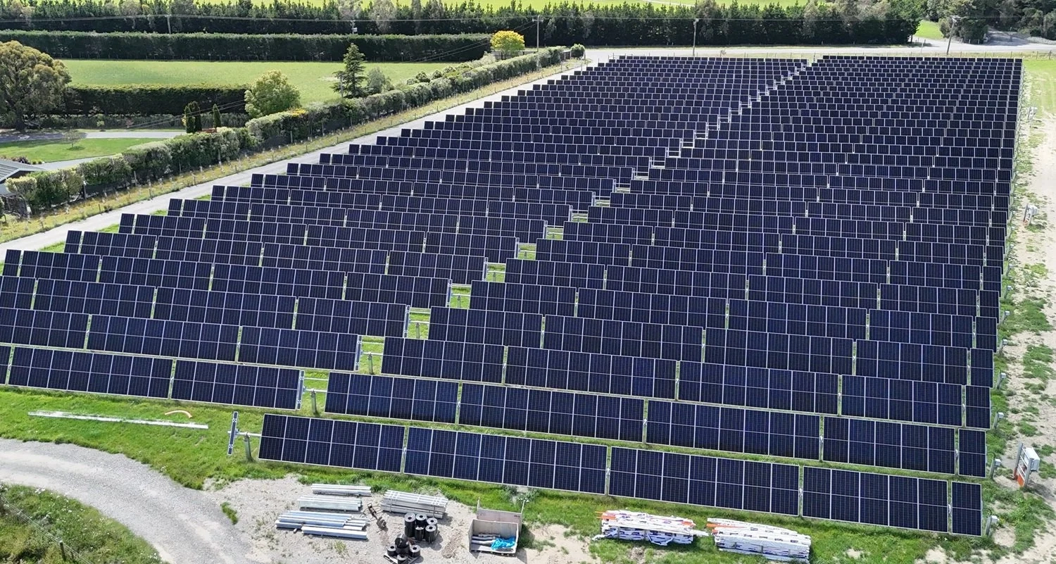 Solar panels with mountains in the background
