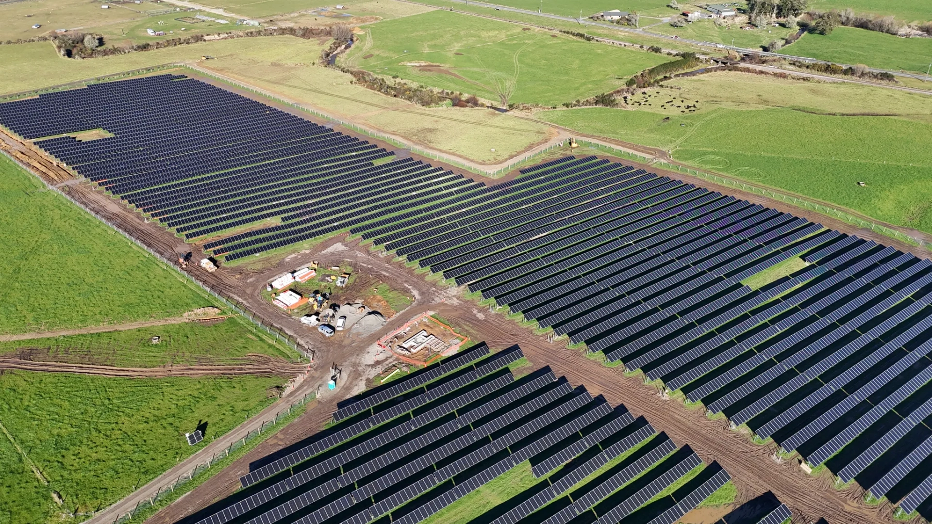 Aerial view of solar arrays and the central construction area at Reefton Solar Farm