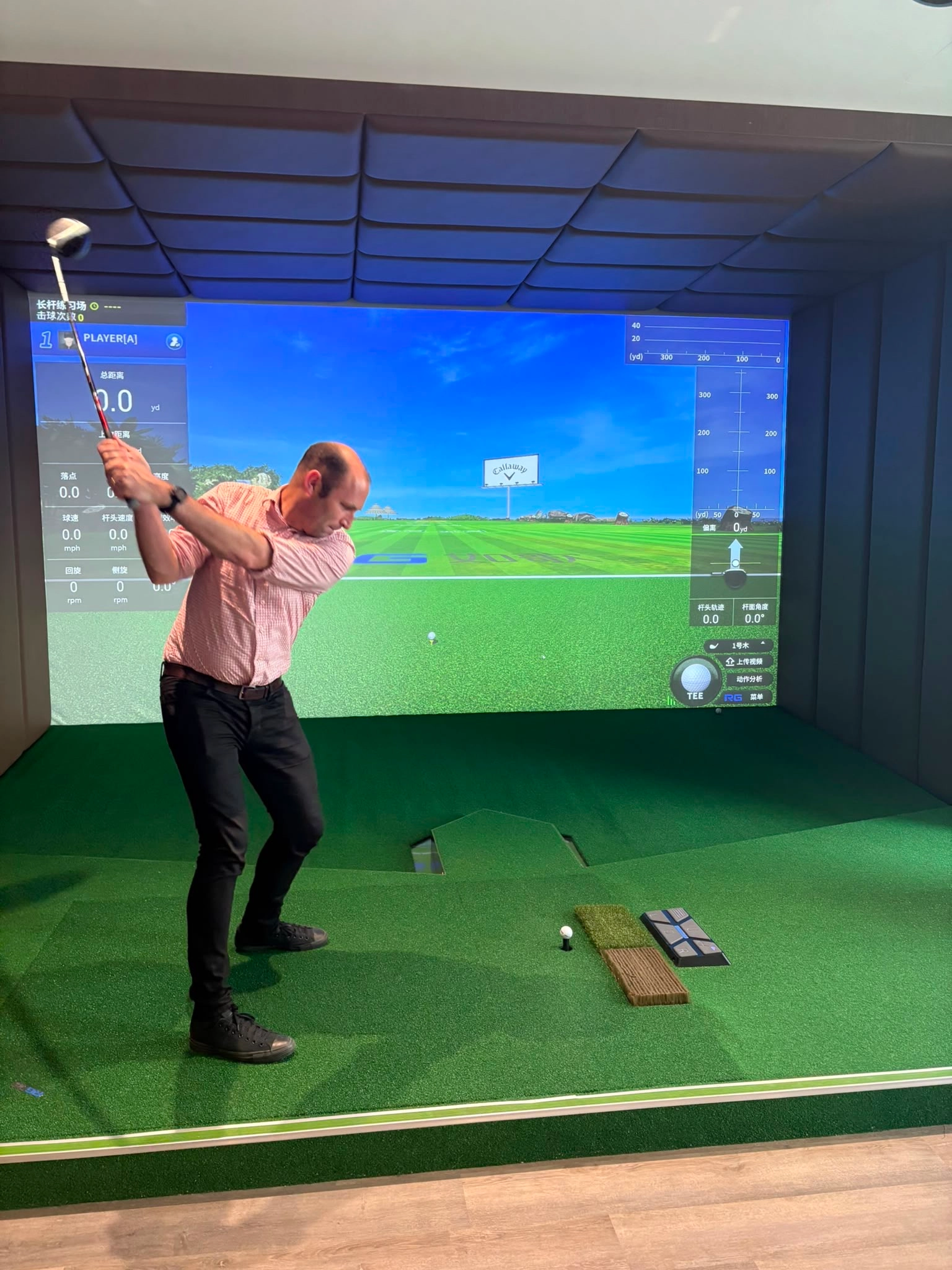 Person using a golf simulator